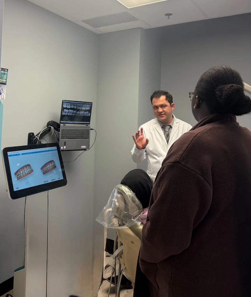 Dr. Karbasi reviewing a digital treatment plan with a patient