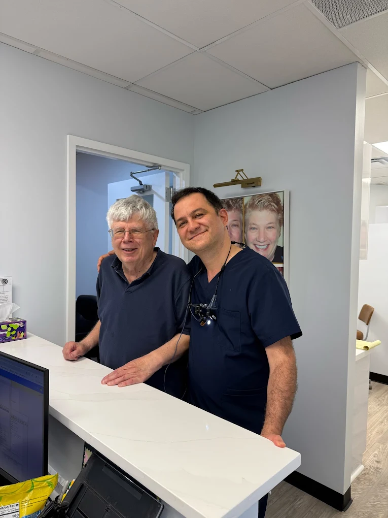 Dr. Karbasi with a patient at the front desk